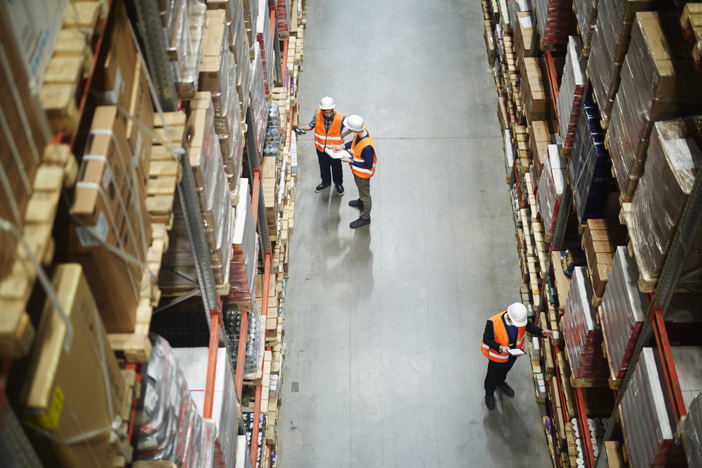 aerial view of 3 employees working for freight shipping services