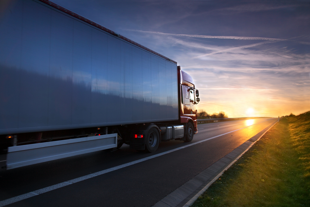 truck driving down highway for 3pl logistics and distribution